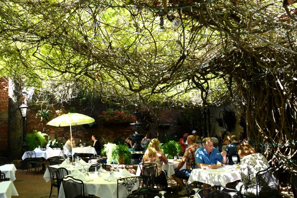 Court of Two Sisters in New Orleans, one of the most romantic restaurants in New Orleans. Dine under a canopy of trees in an open courtyard.