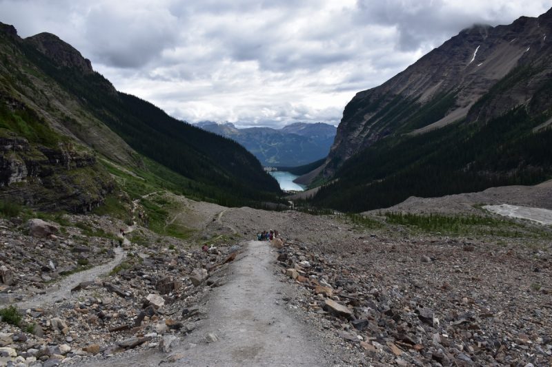 While hiking the Plain of Six Glaciers you'll hit a rocky part of the trail up to Victoria Glacier overlooking Lake Louise in the distance.