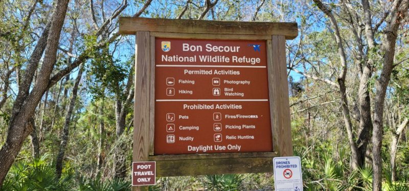 A Bon Secour National Wildlife Refuge sign that states permitted and prohibited activities.