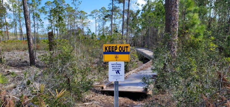 A keep out sign at the Gator Lake Trail in Gulf Shores.