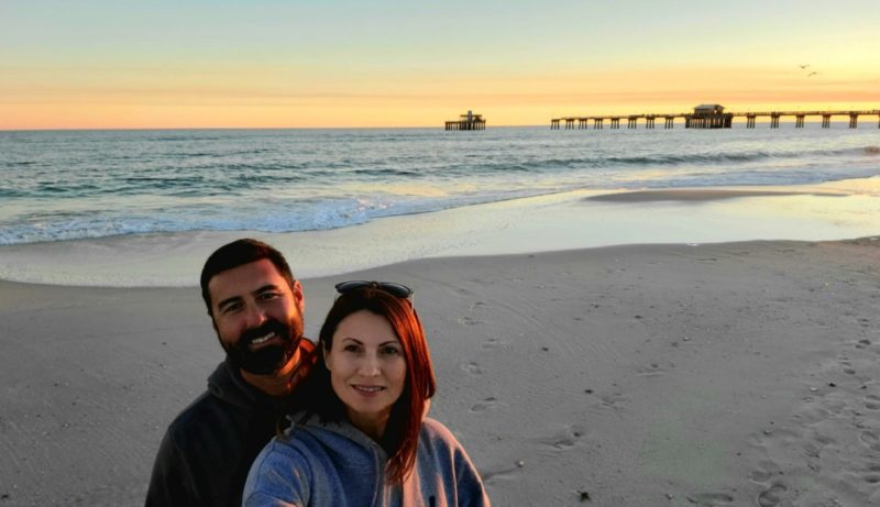 Dang Travelers on the beach watching sunset near Gulf State Park Pier in Gulf Shores.