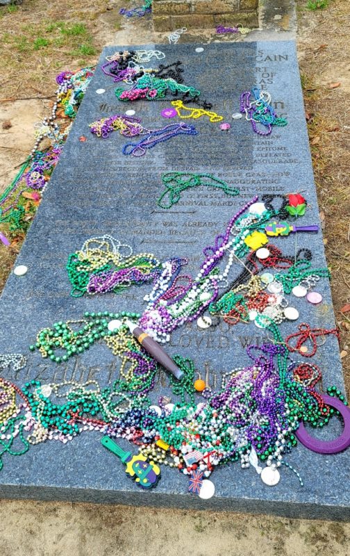 Joe Cain's tombstone that states: Here lies old Joe Cain, the heart and soul of Mardi Gras in Mobile.