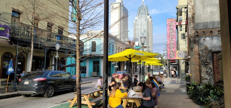 The outdoor picnic tables at Loda Bier Garten on Dauphin Street.