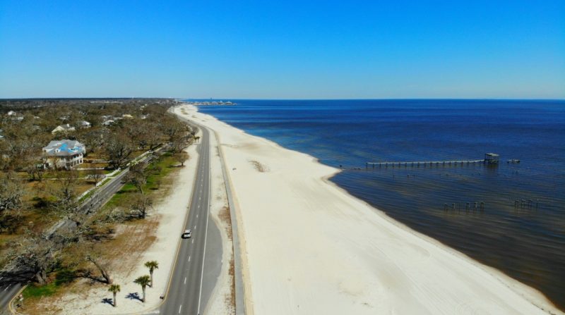 A drone shot of scenic Highway 90, one of the must Mississippi Gulf Coast things to do.