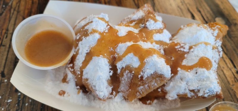 Cinnamon syrup over powdered sugar beignets at Mo'Bay Beignets in Alabama today.