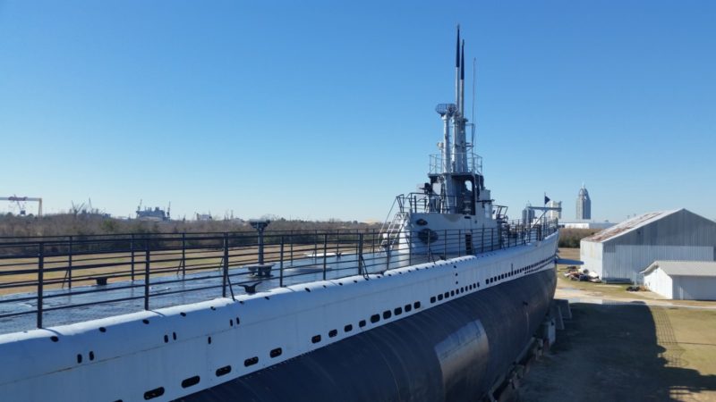 The blue and white exterior of the USS Drum Submarine - Visiting the USS Alabama Battleship Memorial Park is one of the best things to do in Mobile AL with kids.