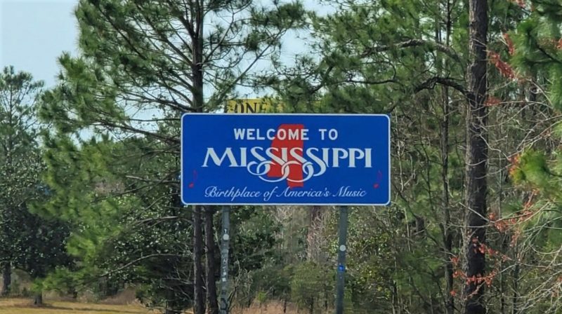 The Blue and Red Welcome to Mississippi Sign