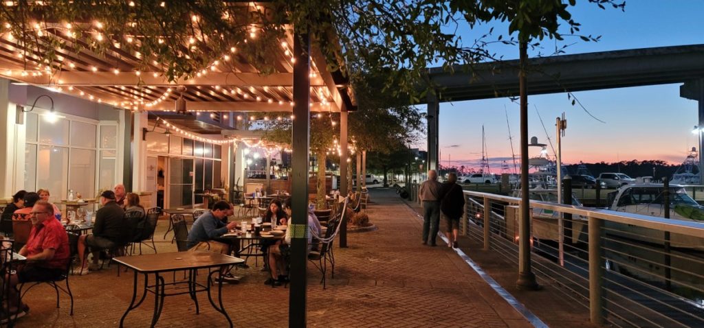 Outdoor patio at Ginny Lane, one of the Orange Beach restaurants on the water at The Wharf.