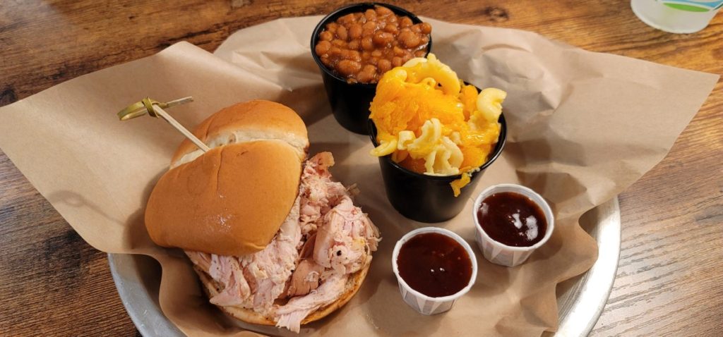 Pulled chicken, baked beans, and macaroni cheese at Hog Wild Barbecue.