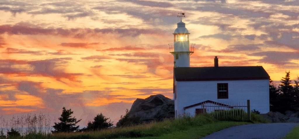 Lobster Cove Head Lighthouse at sunset.