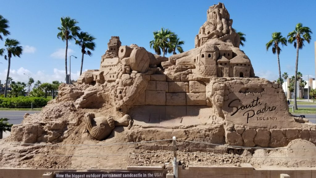 A large sandcastle in South Padre Island, one of the cheap warm winter vacations USA.