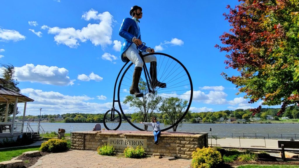 A 30-foot tall man on a bicycle, Will B. Rolling, in Port Byron, Illinois.