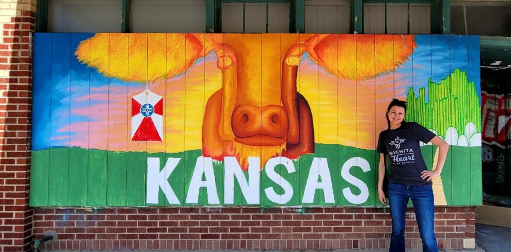 A Kansas mural with a cow that has a Wichita tag on it.