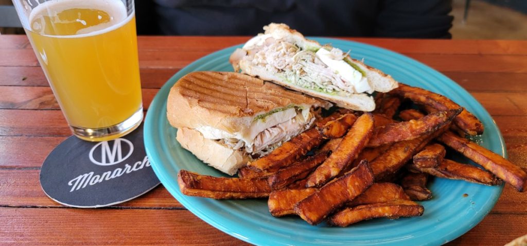 A chicken caprese sandwich with sweet potato fries at The Monarch in the Historic Delano District.