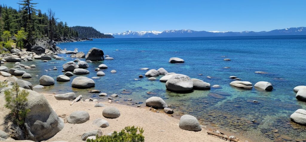 The best Lake Tahoe hiking trails includes the easy Chimney Beach Trail where you'll end up in sand looking out at the beautiful turquoise water.