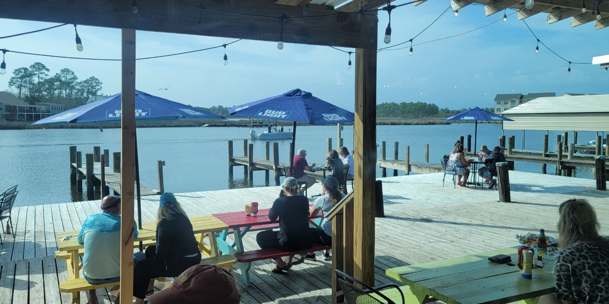 One of the fun things to do in Ocean Springs MS at night is to catch a sunset on the water. Here's a view from The Bayou Restaurant & Tiki Bar.