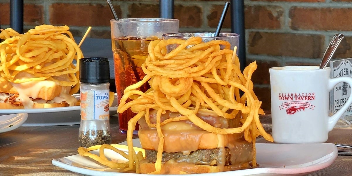 Fries piled high on a burger at Celebration Town Tavern, one of the best restaurants in Celebration Town Center.